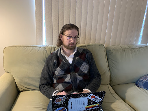 Mr. Crouch hard at work on his couch at Stately Crouch Manor. Photo by Ms. Claire Crouch.