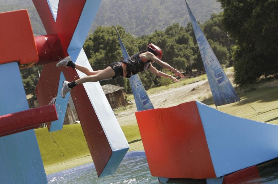 Photo taken by Mike Weaver of a contestant performing a jump on Wipeout, 2011